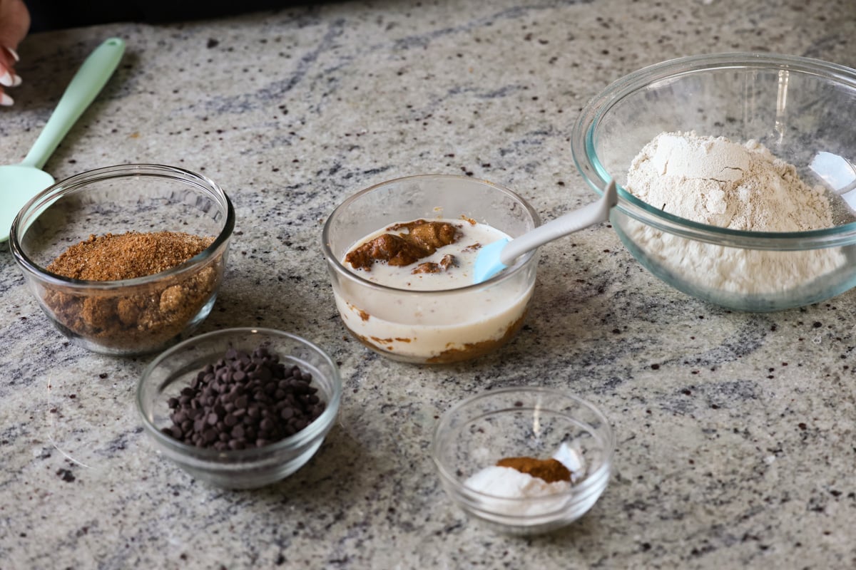 ingredients for almond butter blondies in bowls on the kitchen counter