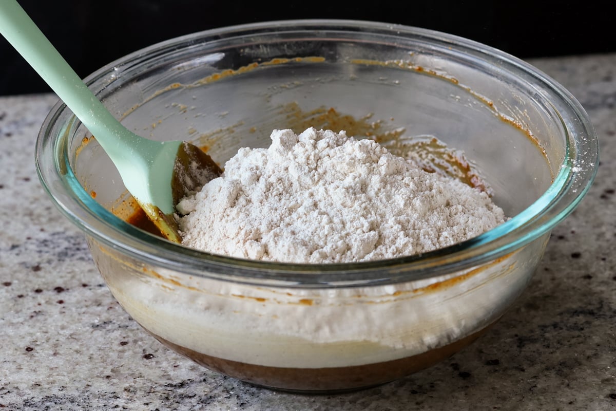 adding the dry ingredients to the bowl