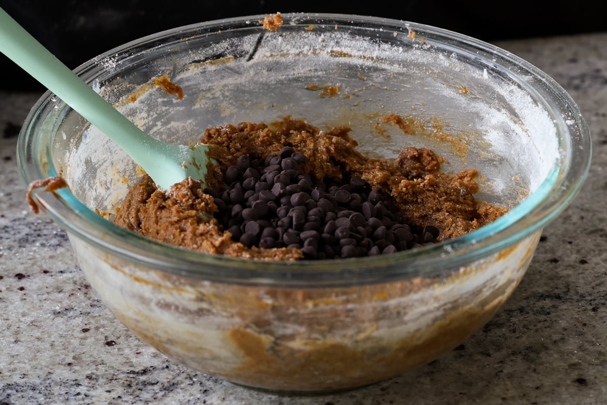 adding chocolate chips to the batter