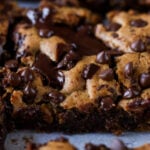 close-up of almond butter blondies on a cutting board after slicing