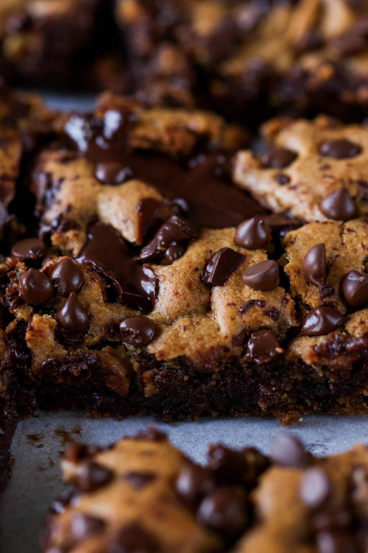 close-up of almond butter blondies on a cutting board after slicing