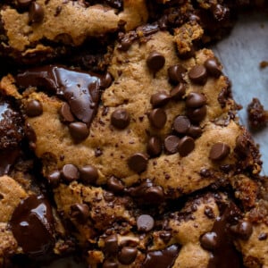 close-up overhead shot of almond butter blondies on a cutting board after slicing