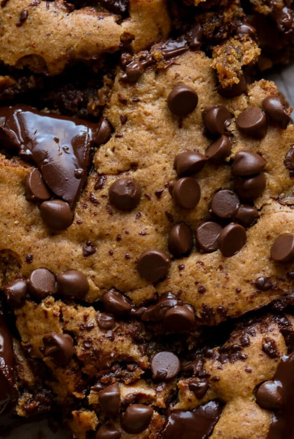 close-up overhead shot of almond butter blondies on a cutting board after slicing