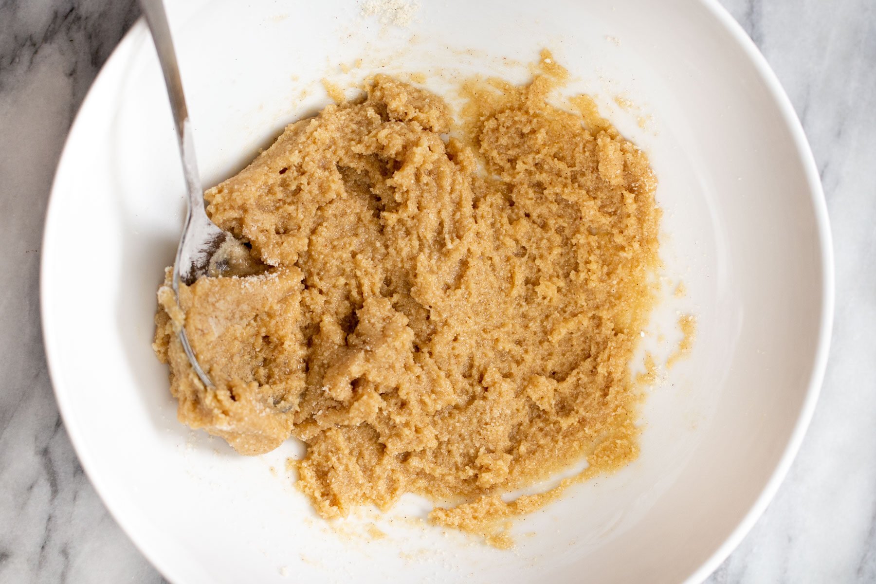 vegan snickerdoodles cookie dough in a white bowl 