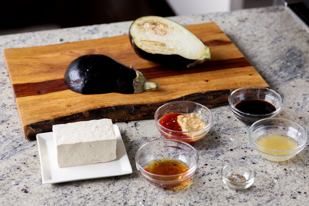 eggplant, tofu, and peanut sauce ingredients on the kitchen counter