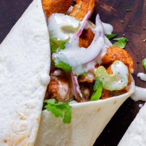 close-up of the top of a closed buffalo cajun wrap, so you can see the soy curls