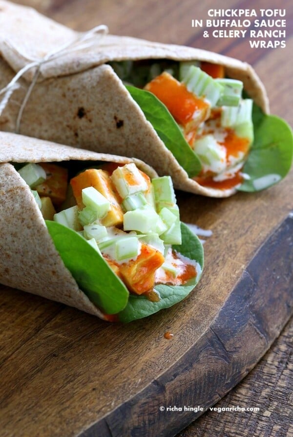 Buffalo Tofu wrap with Chickpea Tofu. Soy-free Chickpea flour Tofu tossed in buffalo hot sauce, layered with celery, spinach, cucumbers and vegan ranch. Easy weekday meal Recipe | VeganRicha.com #glutenfree #veganricha #vegan