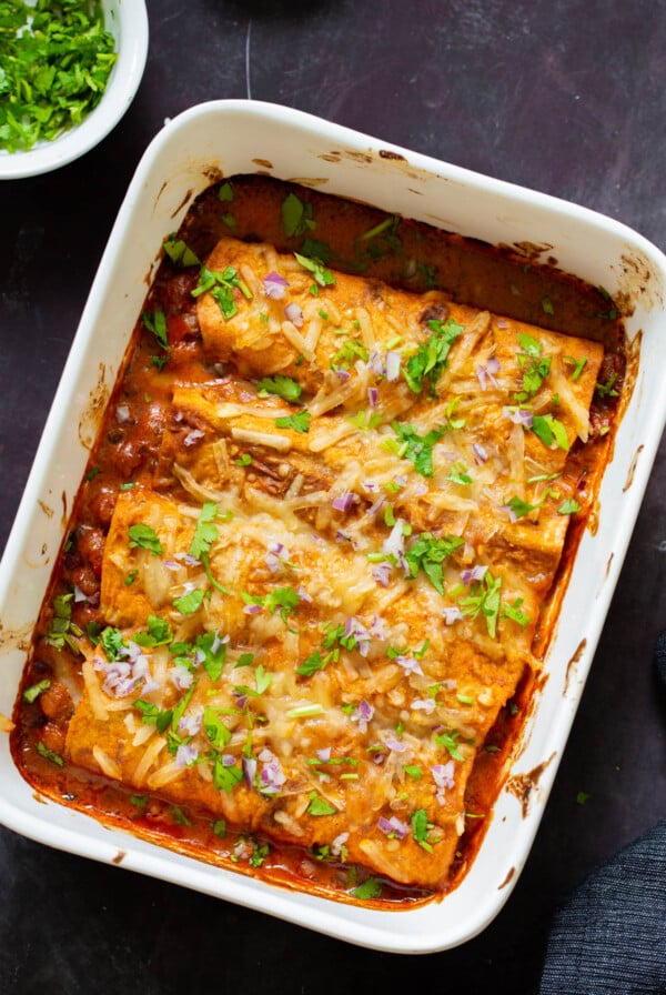 butter chicken enchiladas in the baking pan