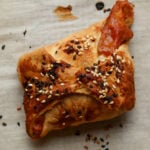 close up of chickpea tikka masala puff on the baking sheet after baking