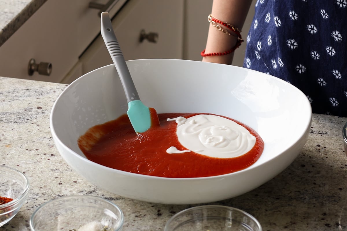 adding yogurt to the bowl