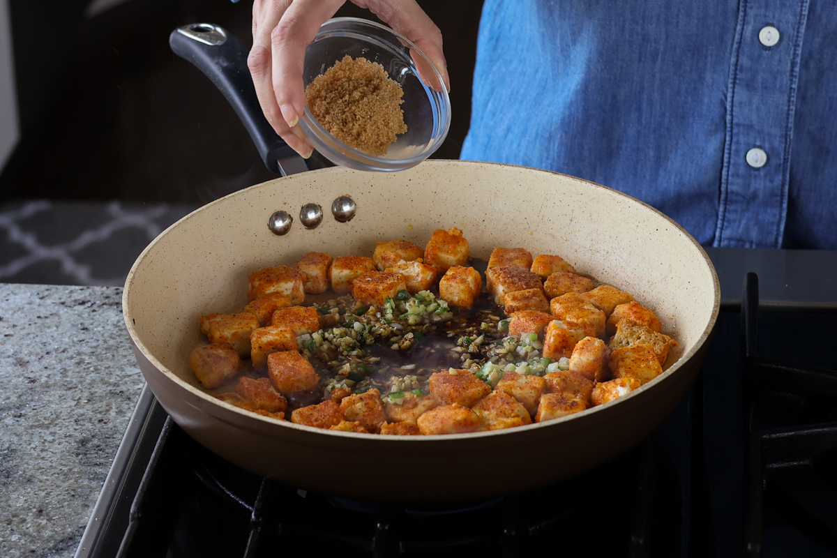 adding ground spices to the pan