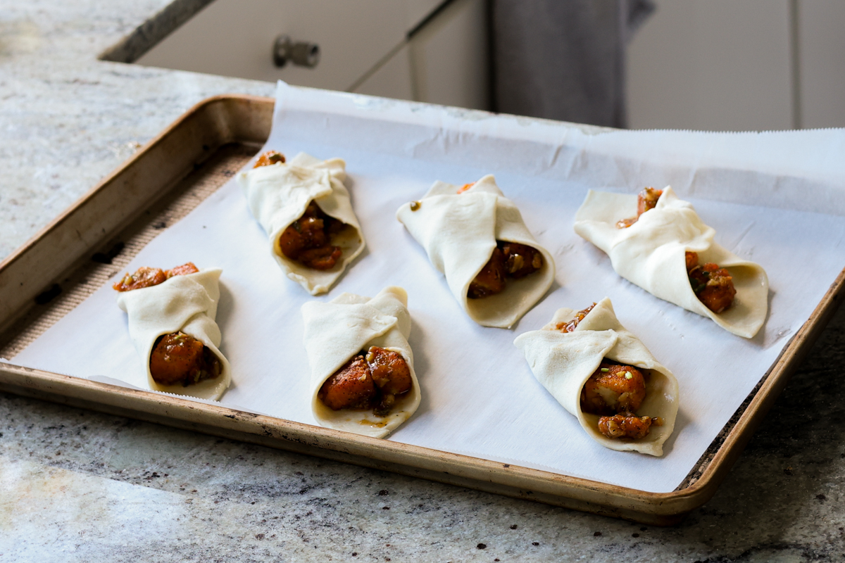 filled tofu puff pastries on the baking sheet