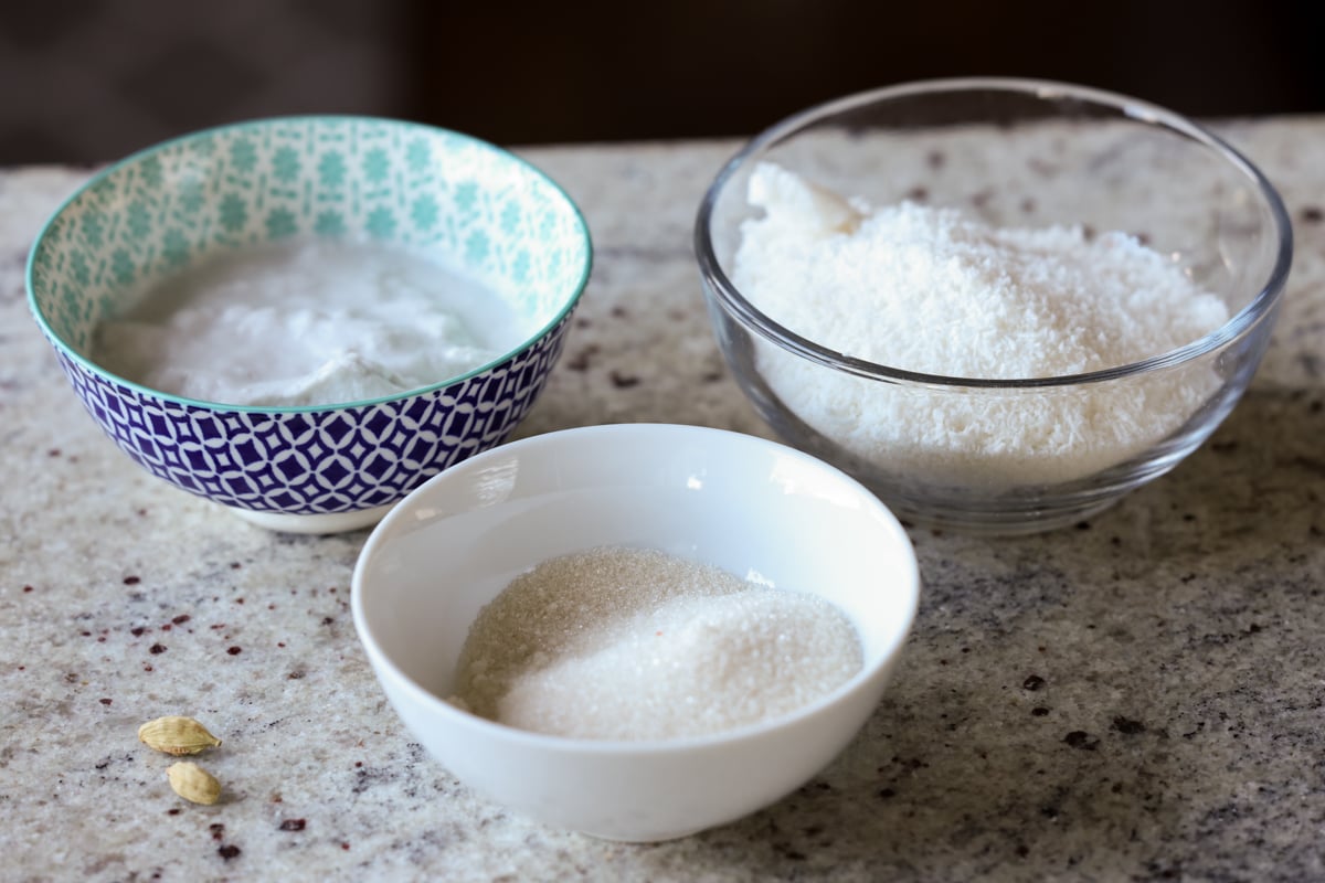 toasted coconut ladoo ingredients in bowls