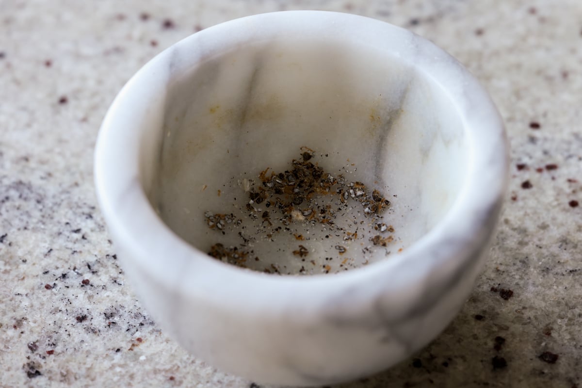 ground cardamom in a mortar