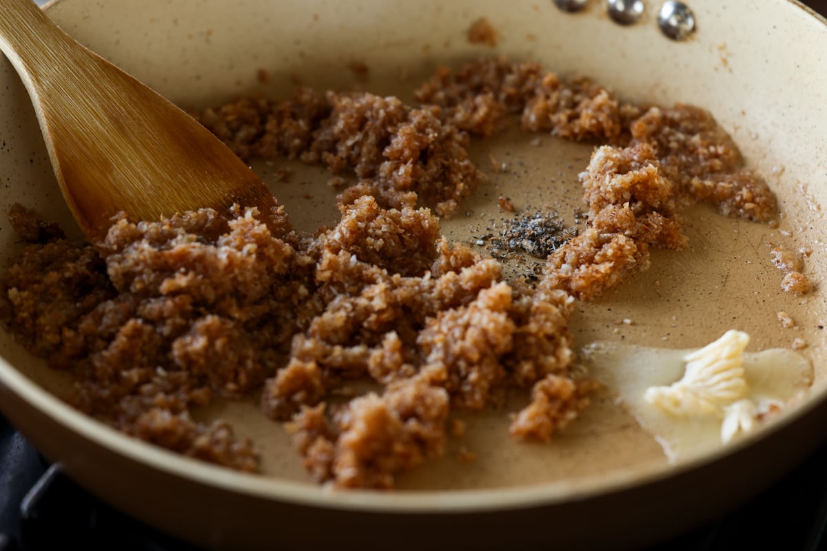 adding cardamom to the pan