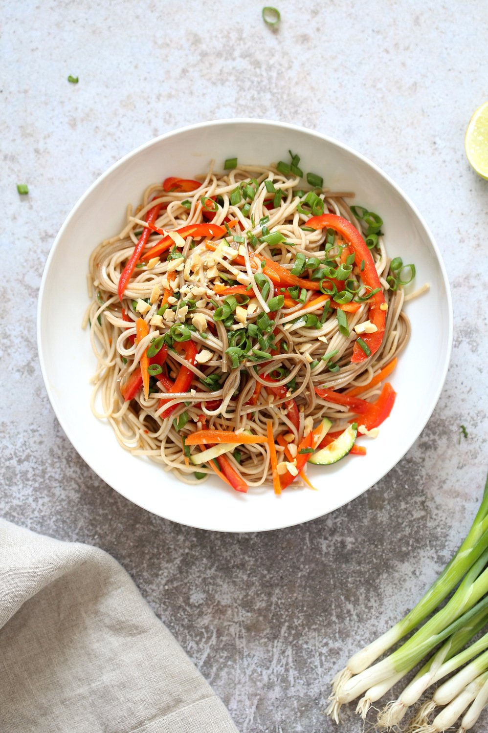 Our Cold Soba Noodle Salad Bowl in white bowl over concrete