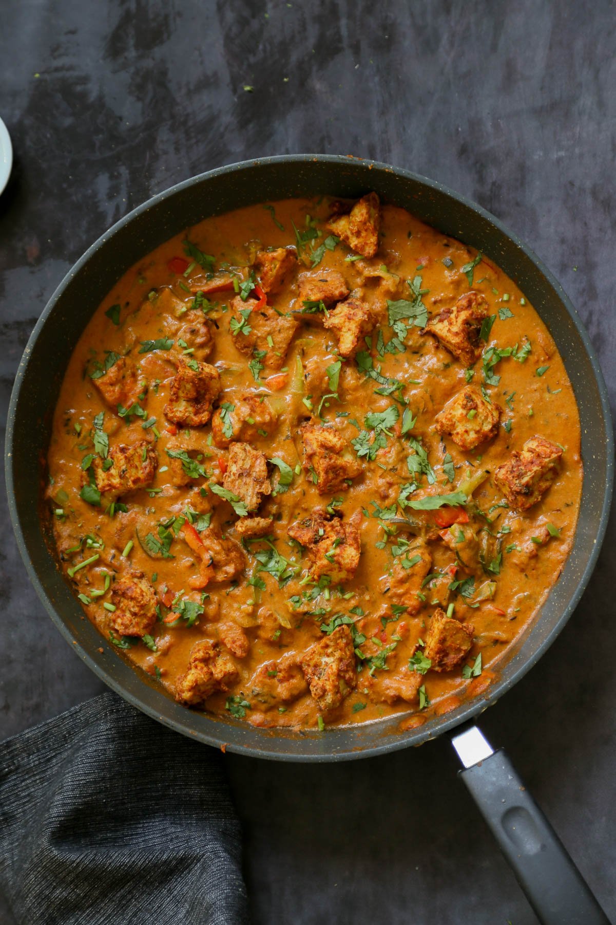 panful of tofu tikka masala with cilantro on top