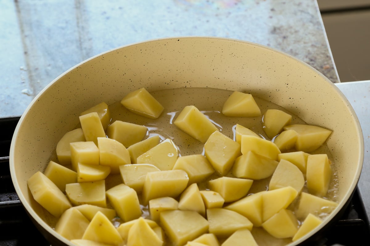 potatoes and water in the pan before cooking