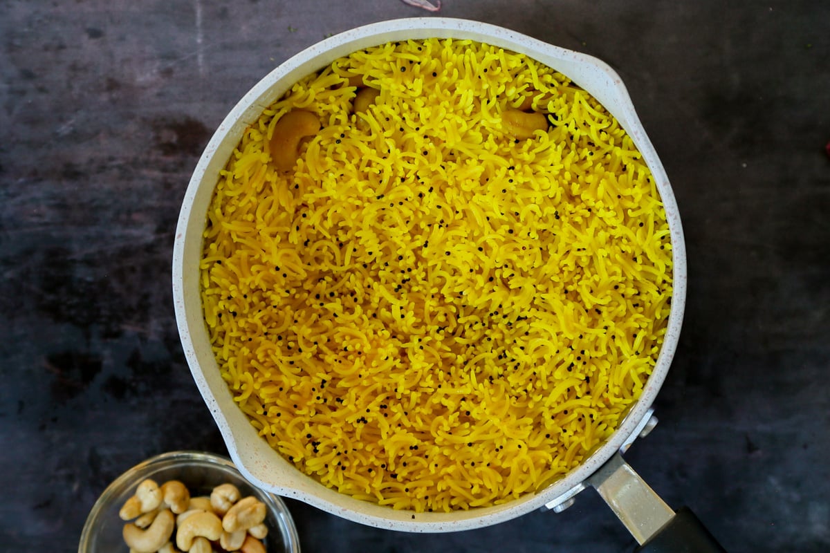 cooked cashew turmeric rice in the pan