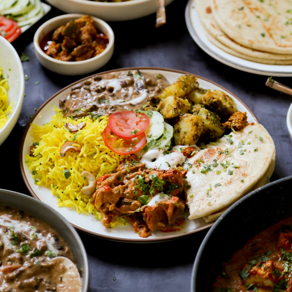 plate of no onion no garlic Diwali food surrounded by serving bowls