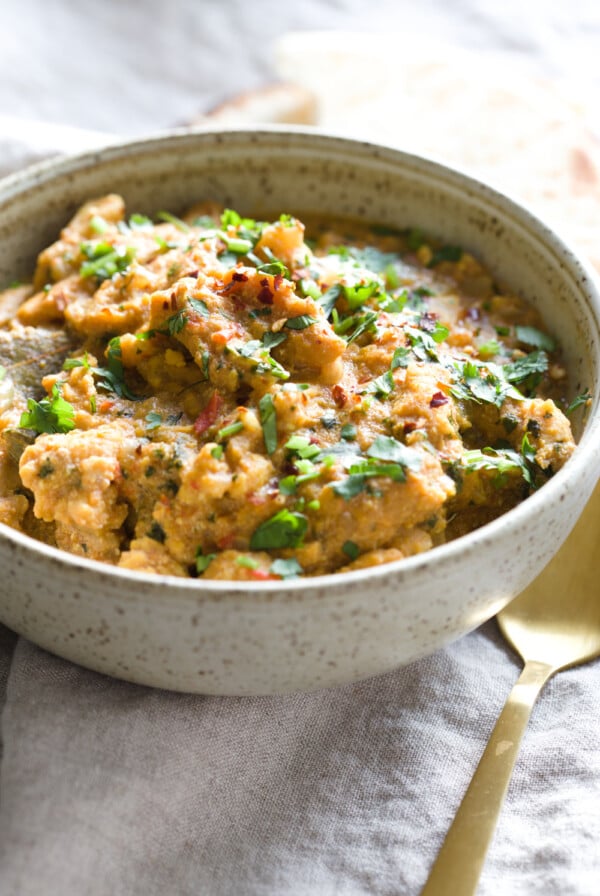 side view of a bowl of vegan Instant Pot chicken curry with soy curls in fenugreek sauce