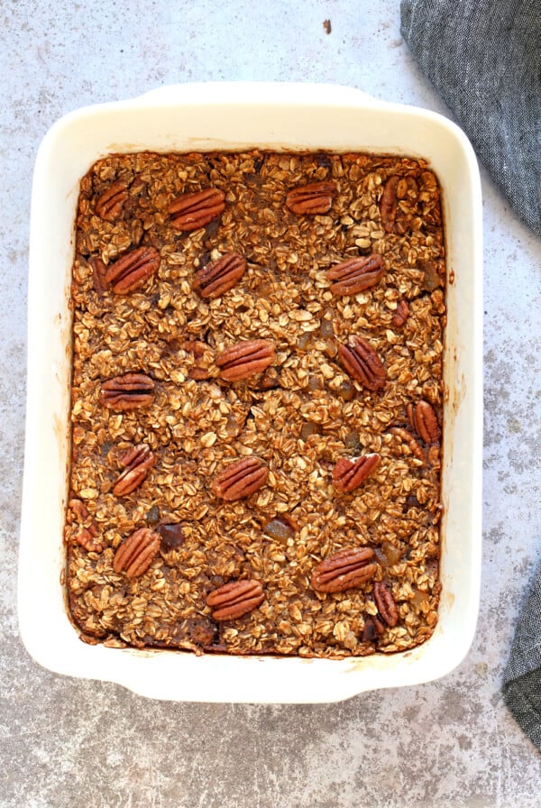 Vegan Gingerbread Baked Oatmeal in a white baking dish