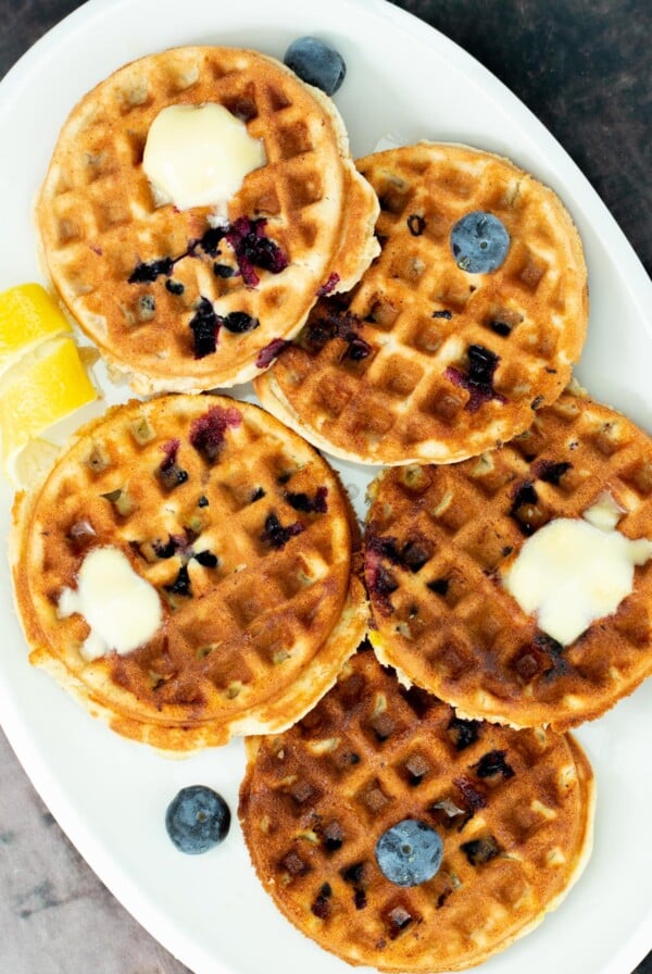 a plate of gluten-free lemon blueberry waffles