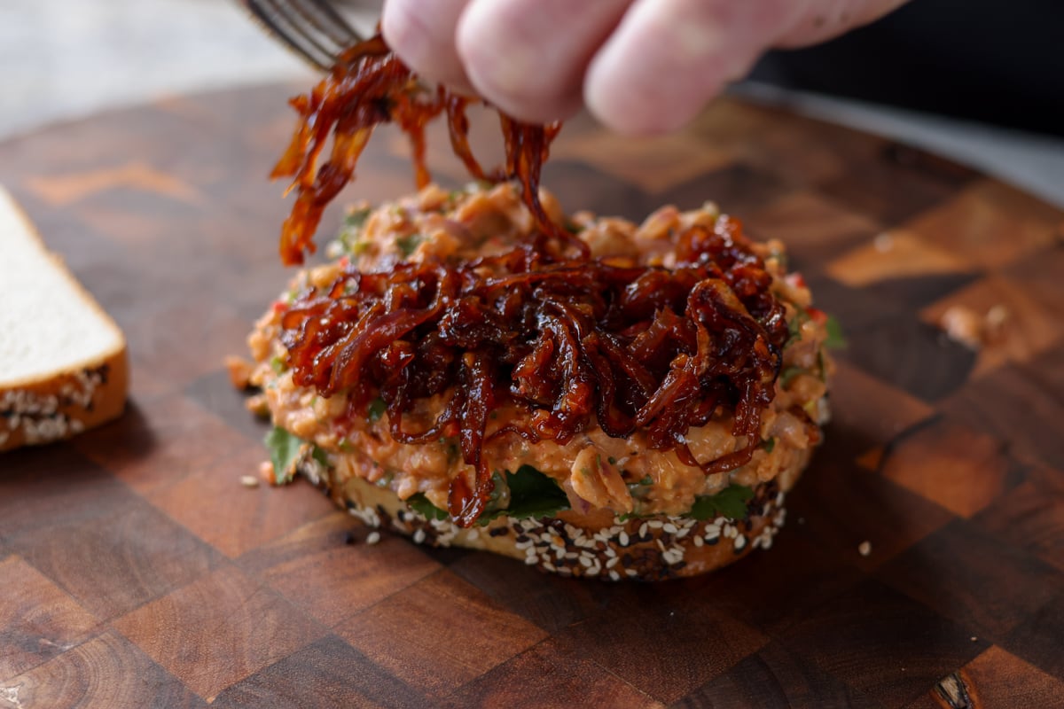 topping the gochujang chickpea salad with caramelized onion