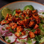 harissa tofu bowl with fresh veggies and herbed rice