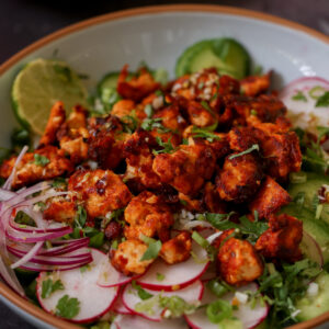 harissa tofu bowl with fresh veggies and herbed rice