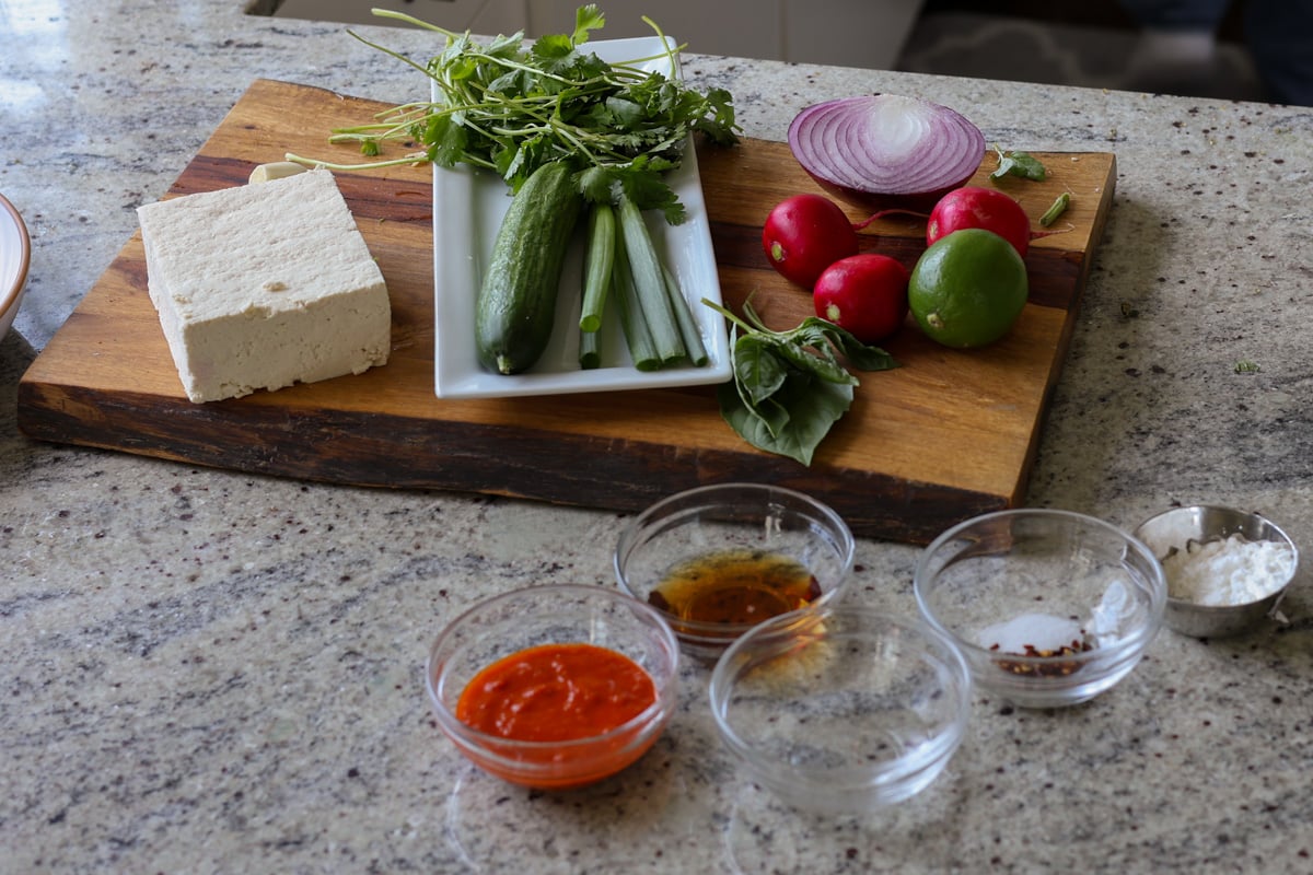 harissa tofu bowl ingredients on the kitchen counter