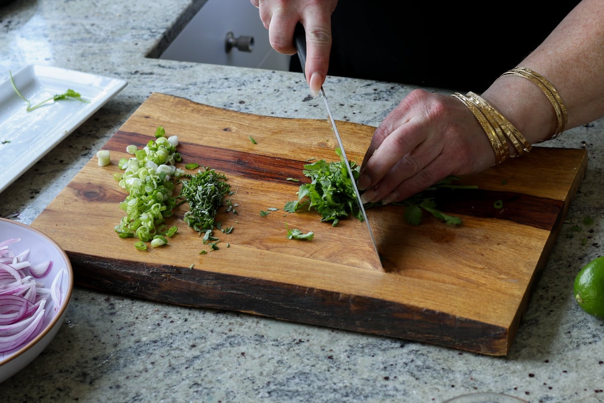 mincing the herbs