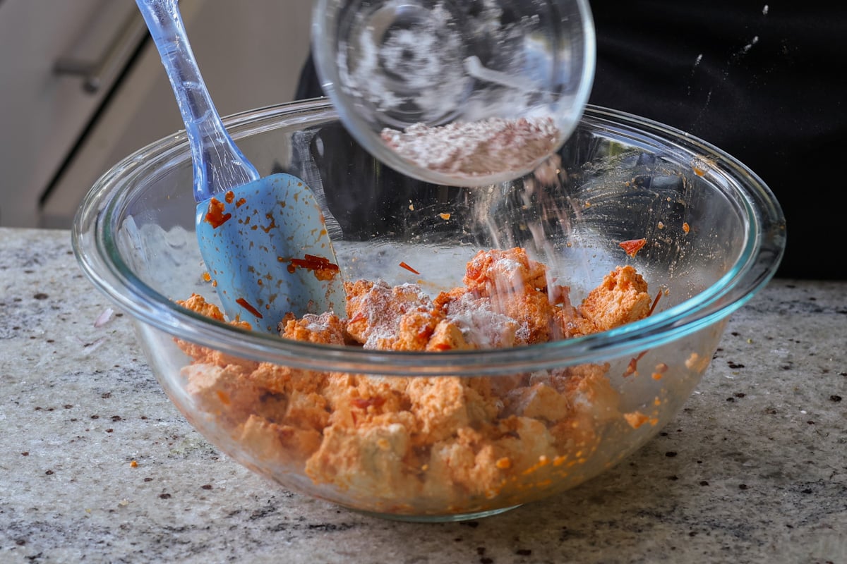 sprinkling cornstarch mixture over the tofu