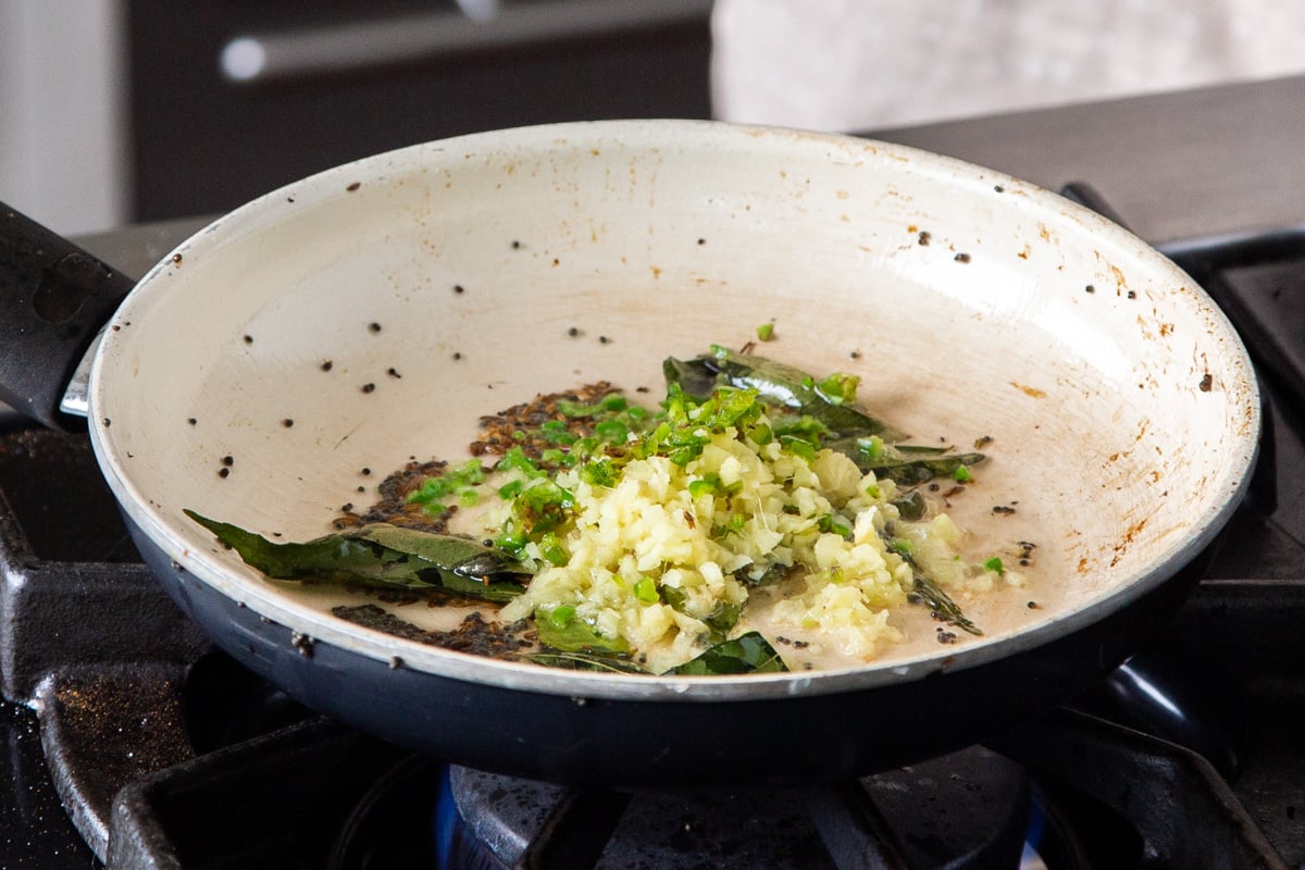 spices, chili and ginger in a sauteeing pan 