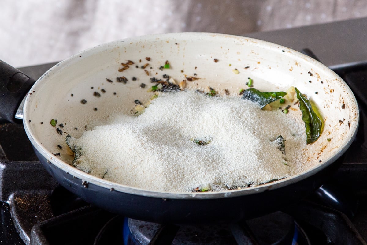 spices, semolina, ginger and chili in a sauteeing pan 