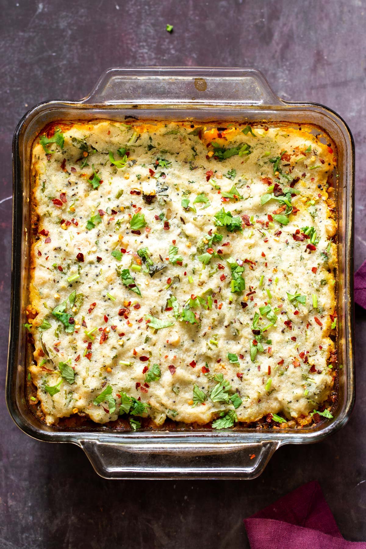 Vegan Idli sambar casserole in a glass casserole dish