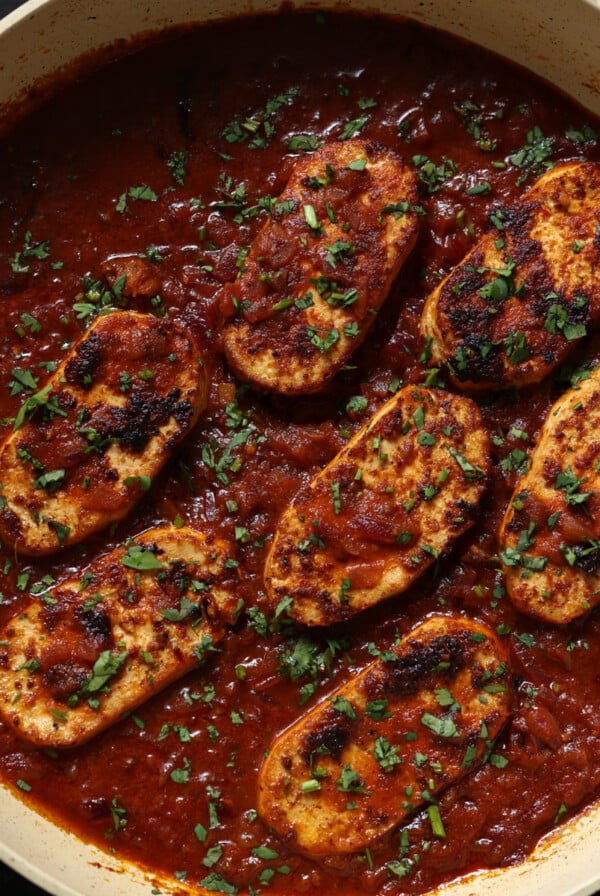 pan of peri peri chicken with garnish