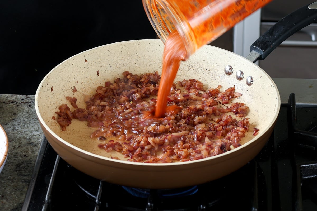 adding peri peri masala to the pan