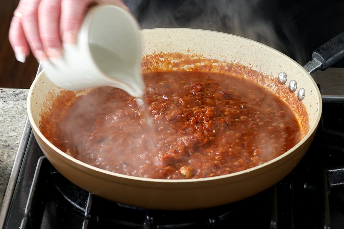 adding water to the peri peri sauce