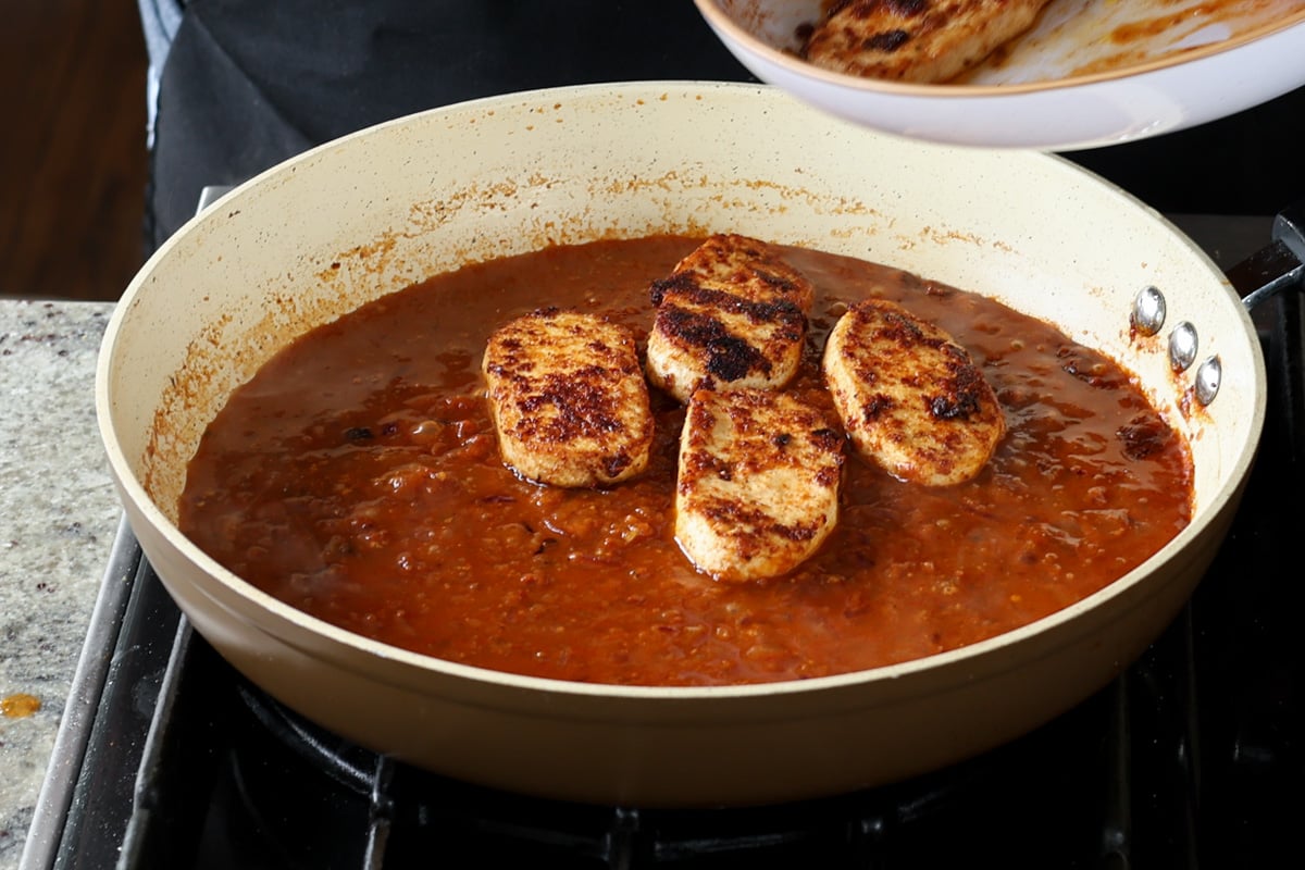 adding the tofu cutlets to the peri peri sauce