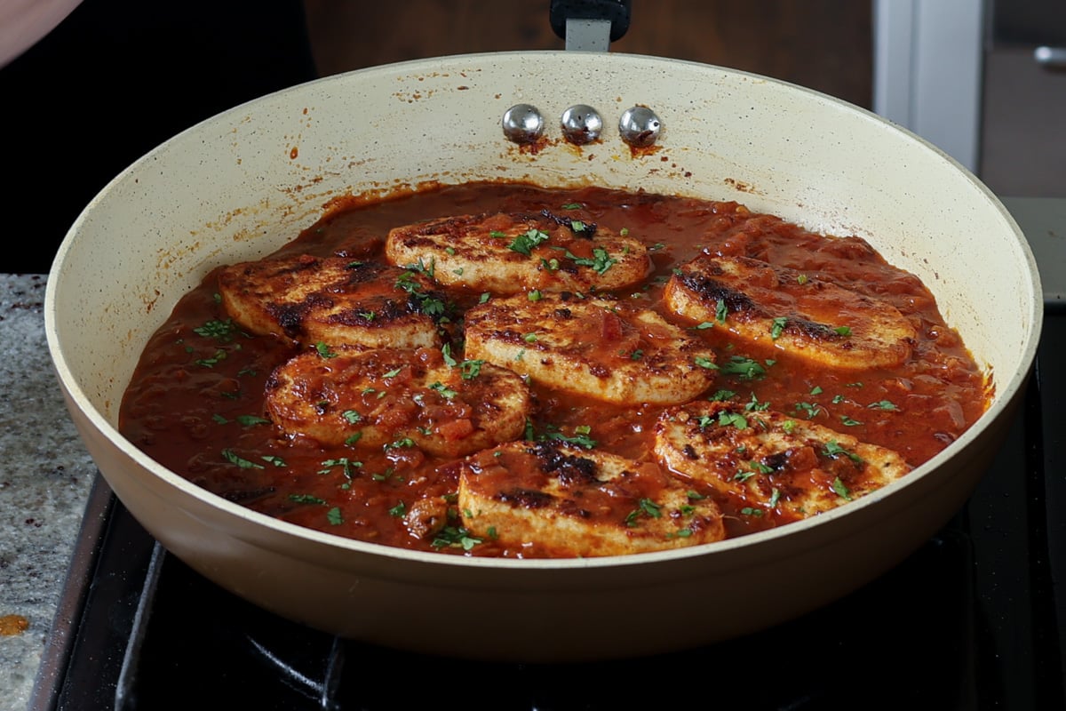 tofu cutlets simmering in the peri peri sauce