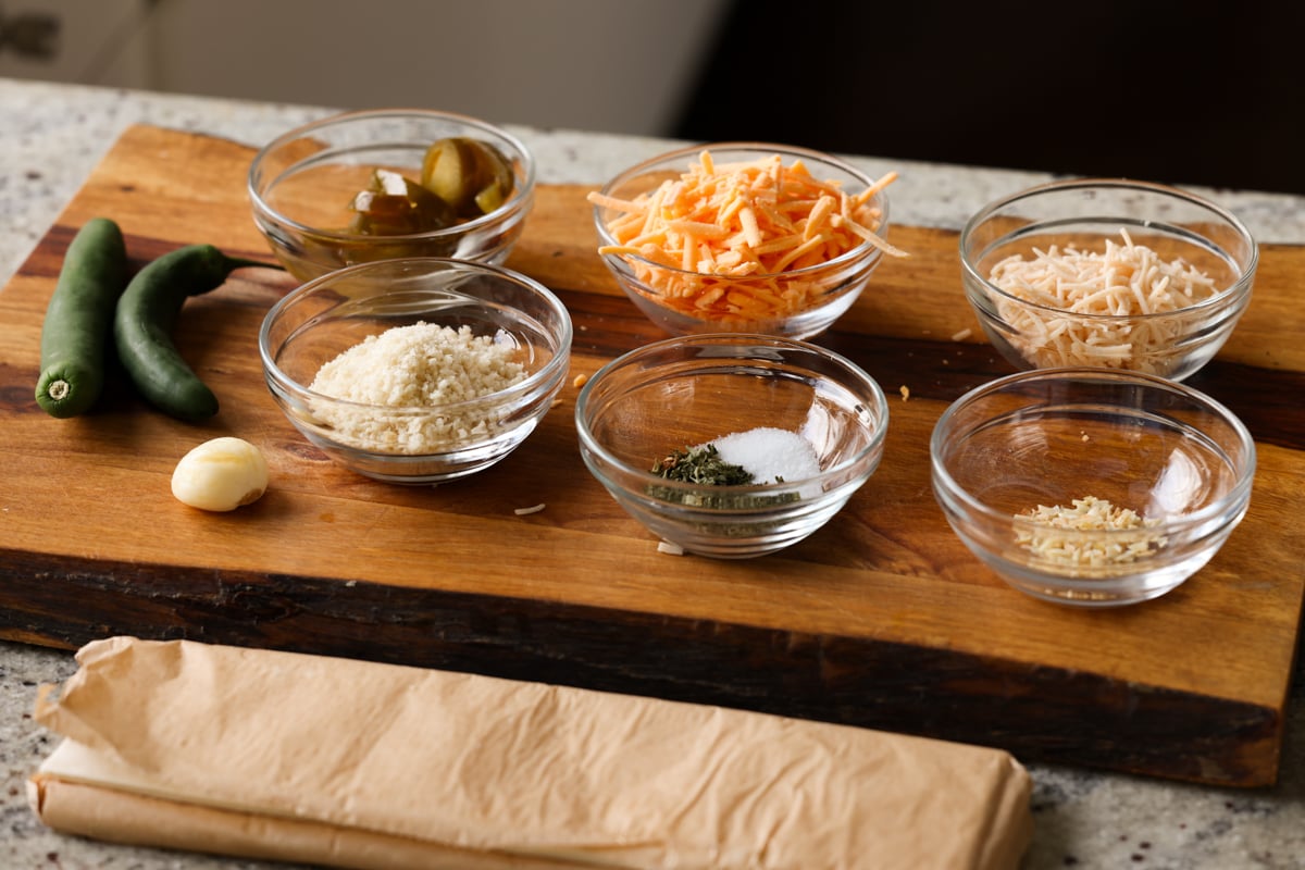 ingredients for jalapeño popper pinwheels on the cutting board before prepping