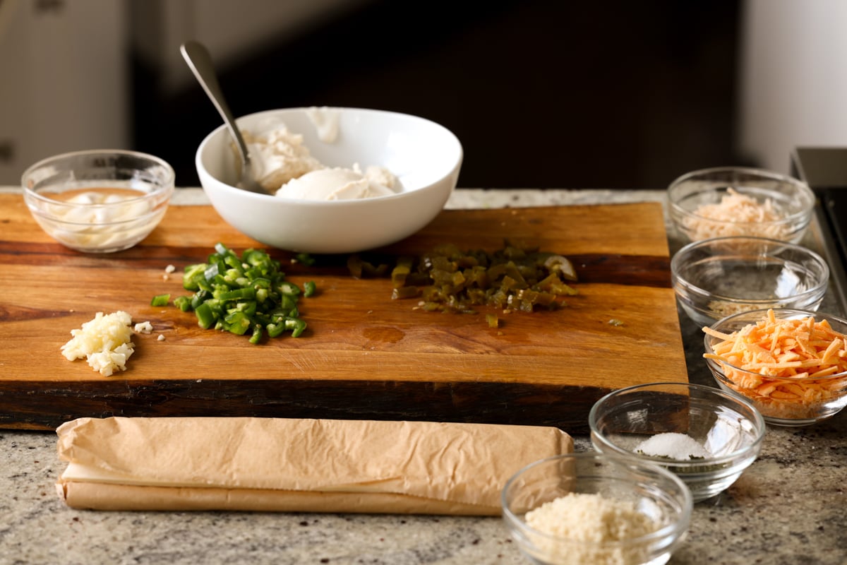 ingredients for jalapeño popper pinwheels on the cutting board after prepping