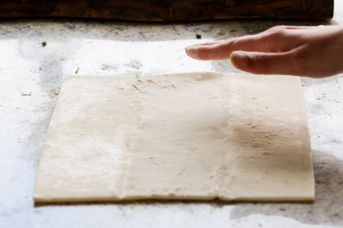 flouring the puff pastry sheet