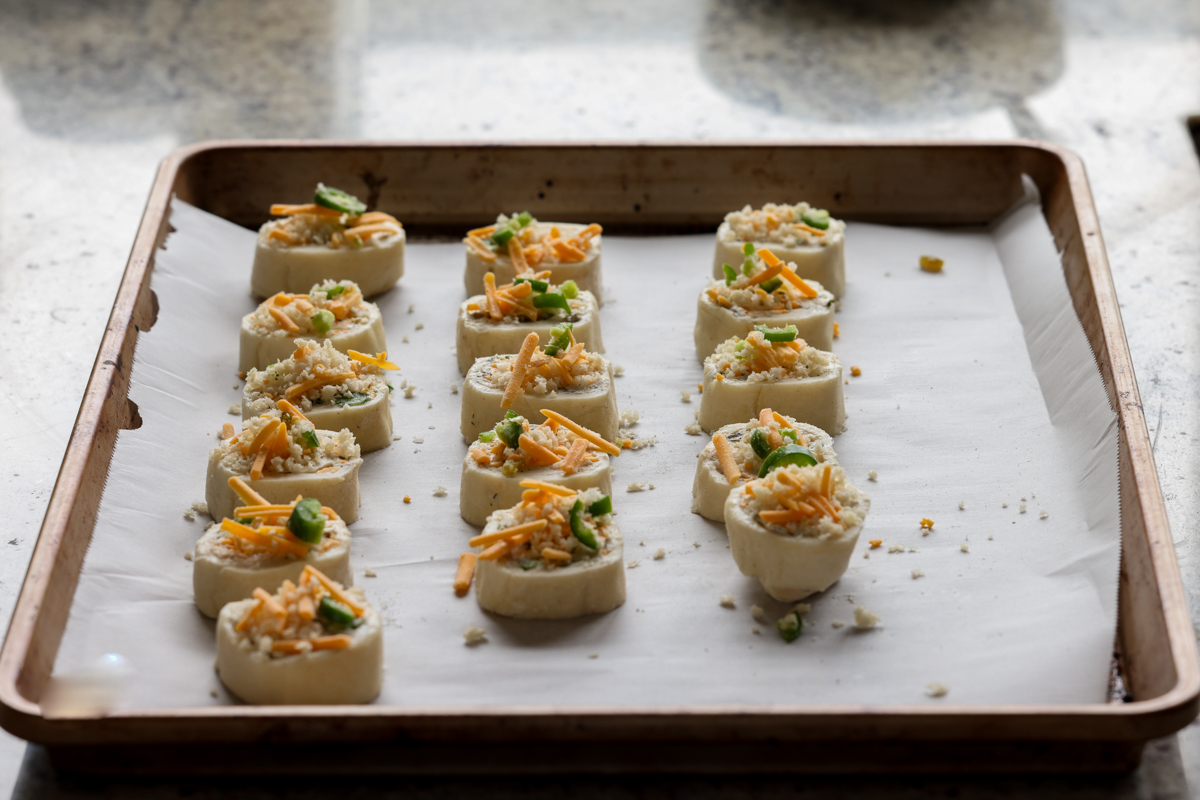 jalapeño popper pinwheels on the baking sheet before baking