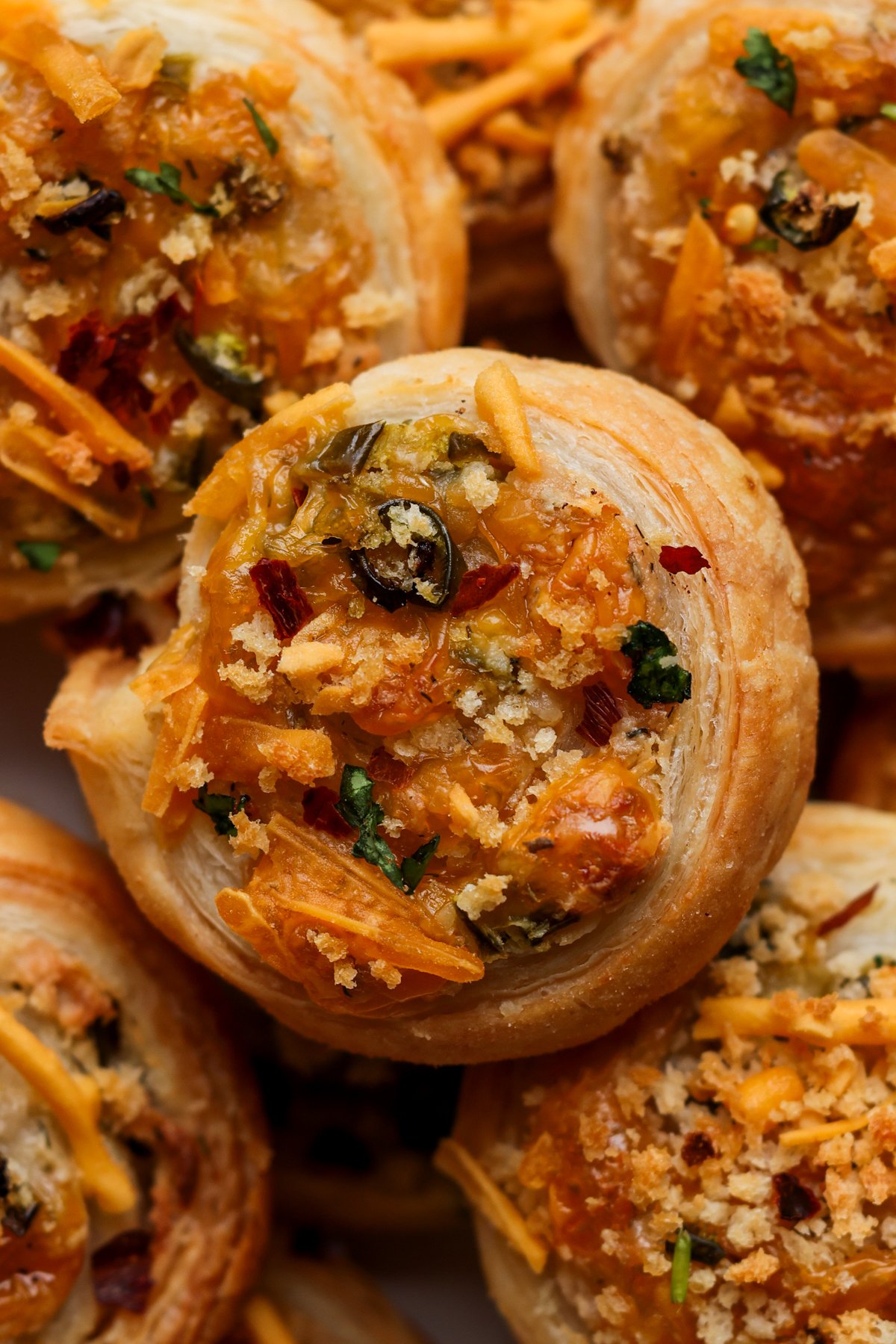 close-up of jalapeño popper pinwheels on a serving platter