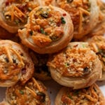 close-up of jalapeño popper pinwheels on a serving platter