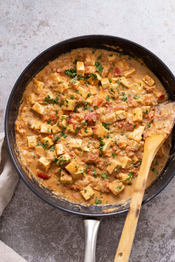 overhead shot of a skillet with kali mirch tofu in black pepper sauce