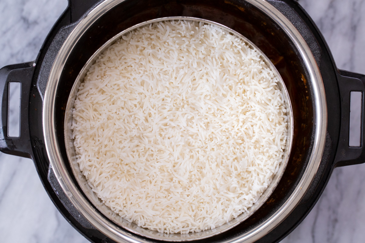 Instant Pot with pan of rice in it, before cooking