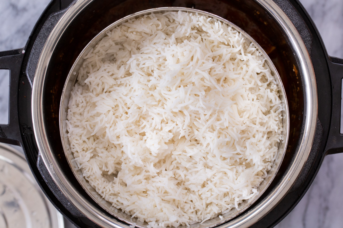 Instant Pot with pan of rice in it, before cooking